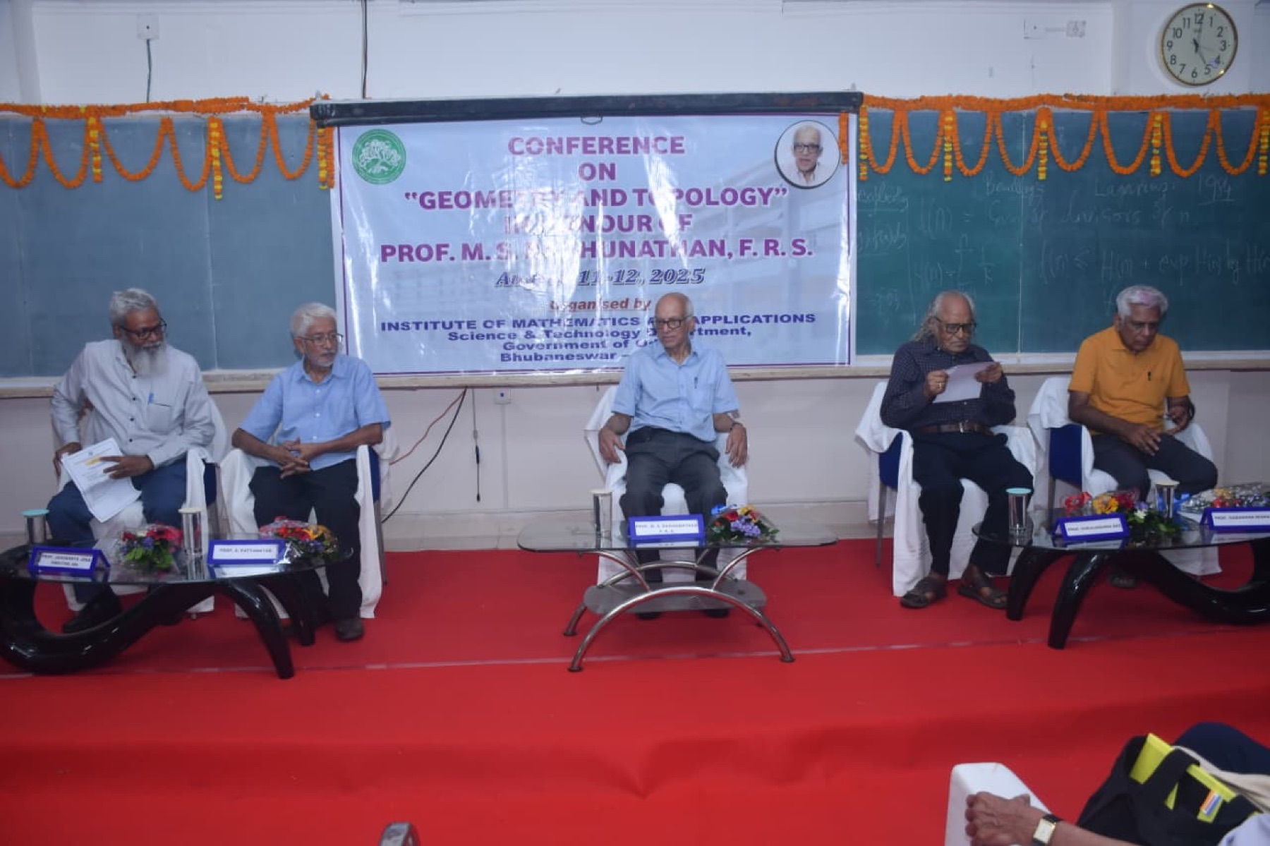 Dr. Das on the dais at a conference on Geometry and Topology at IMA Bhubaneswar