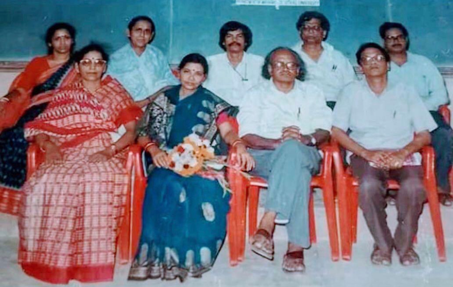 Dr. Das seated with faculty colleagues of the Department of Mathematics